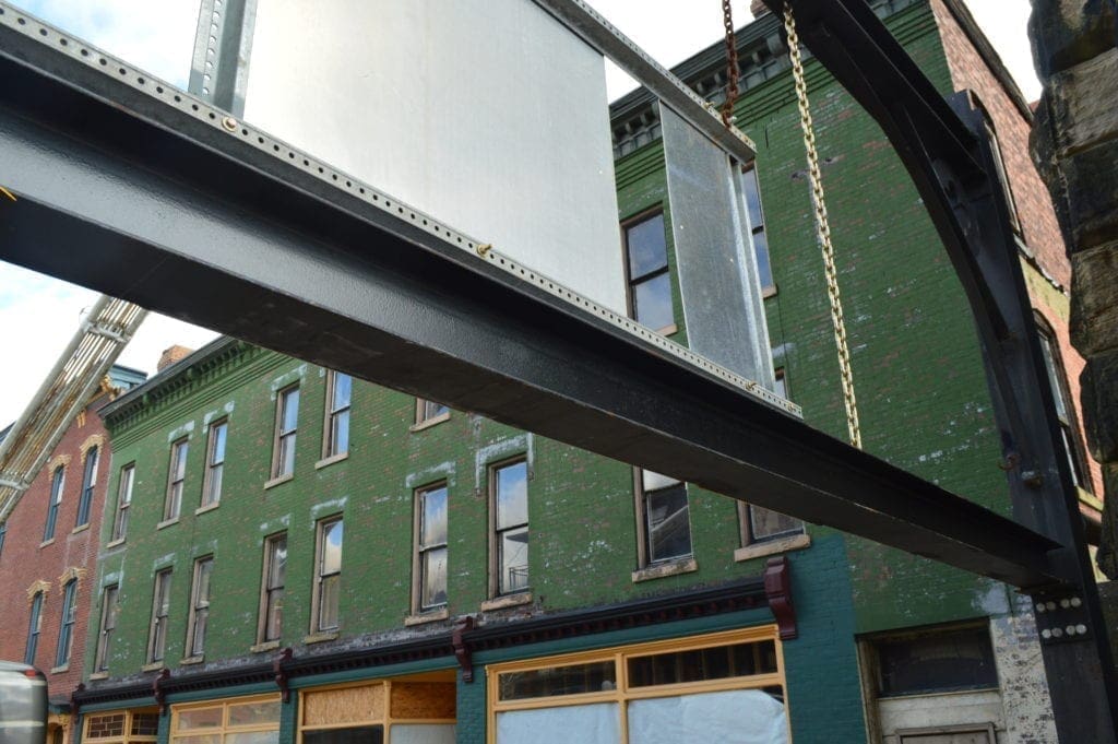 A photo of a steel bar on the Wheeling Suspension Bridge that enforced the height limit on the span.