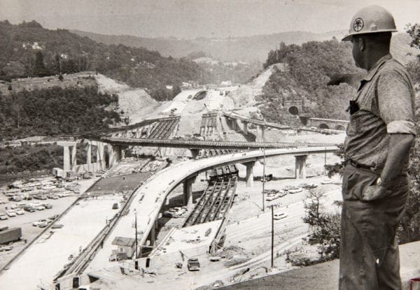 A construction worker perched above Wheeling Tunnel.