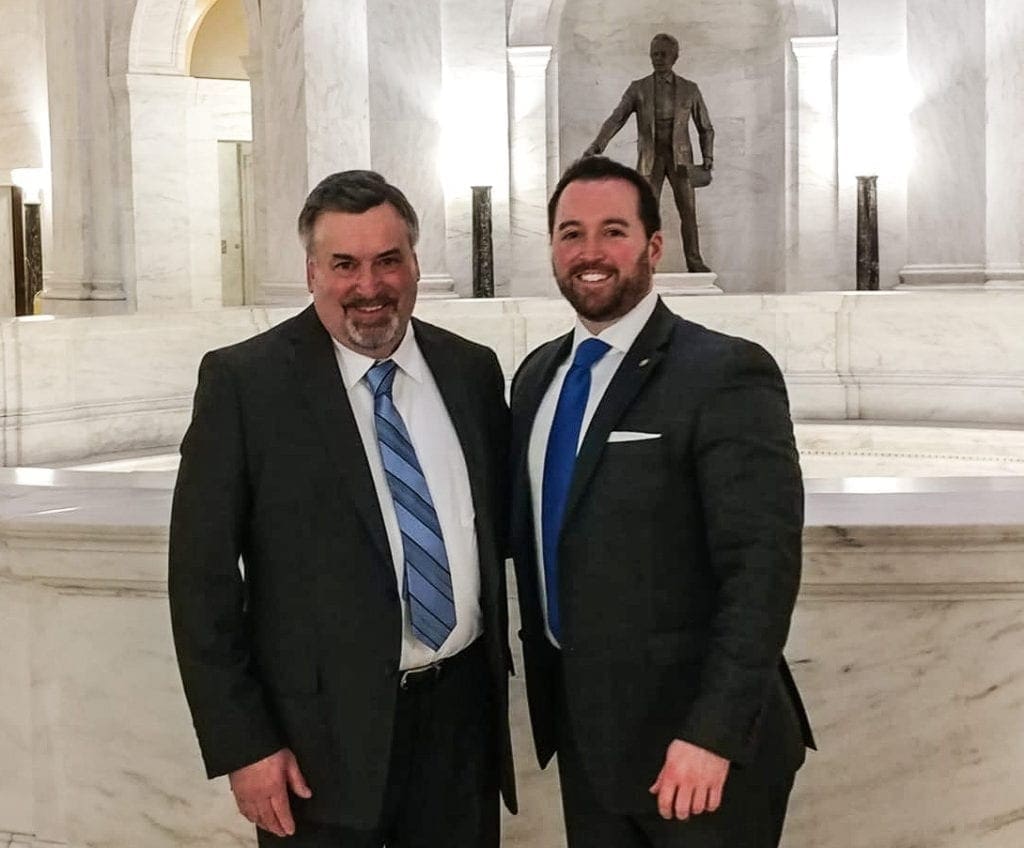 Two men in suits and ties.