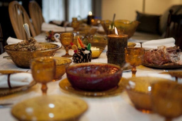 A photo of a dining room set for a Thanksgiving dinner.