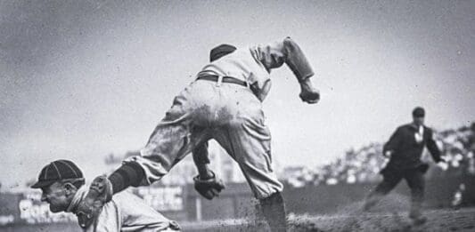 Ty Cobb sliding into third base.