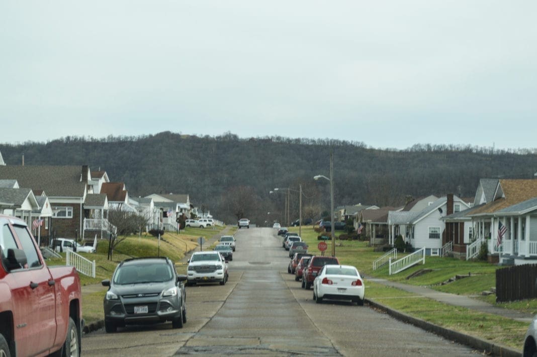 A photo of a street full of houses.