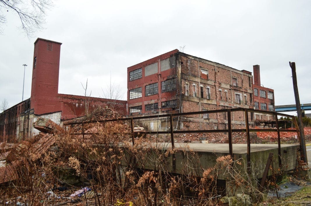 A photo of an old, vacant factory.