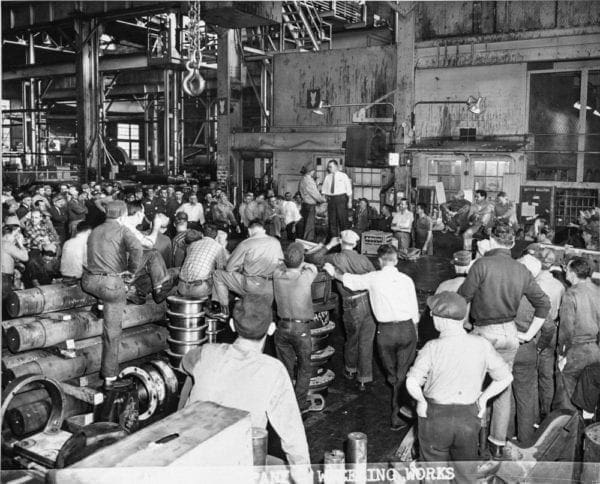 A large group of men in a Blaw Knox 
 factory.
