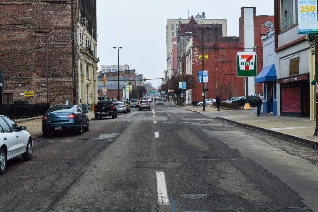 A photo of a beaten up street.