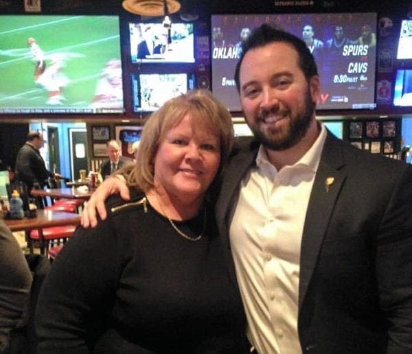 A lady and a young man.