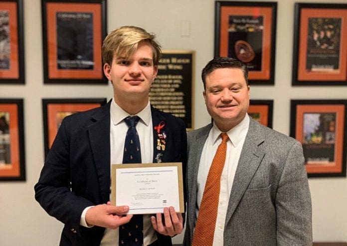 A senior student with his headmaster.