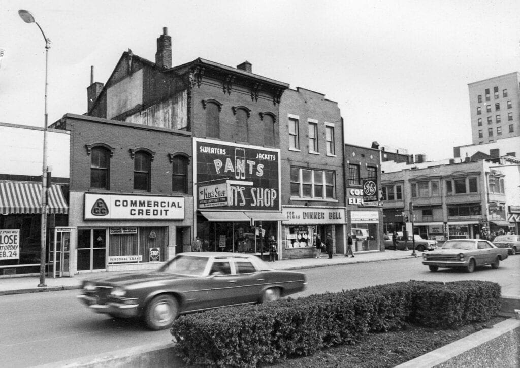 A historic photo of a street corner.