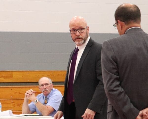 Attorney David Croft motions to COO Bernie Albertini to answer a question asked by Martins Ferry City Council