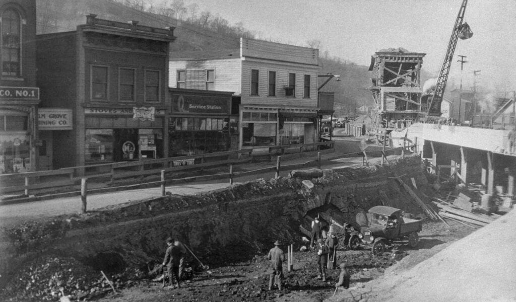 Construction scene of the construction of a train trestle.