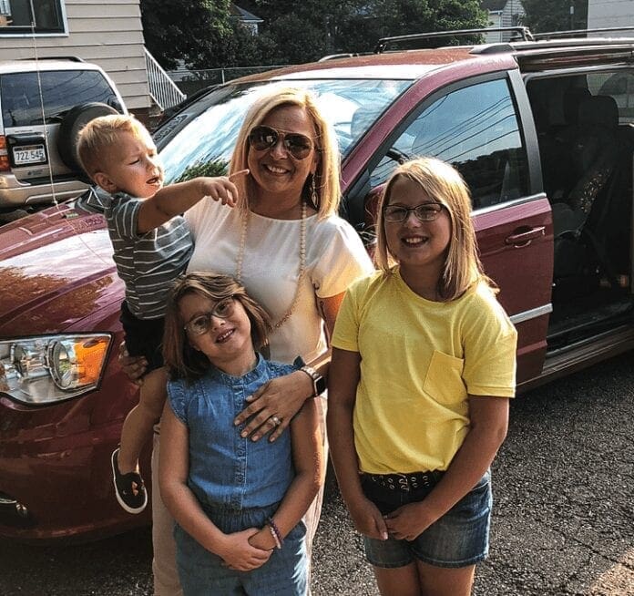 A mother with her three children.