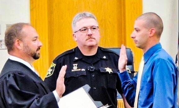 A deputy being sworn in.