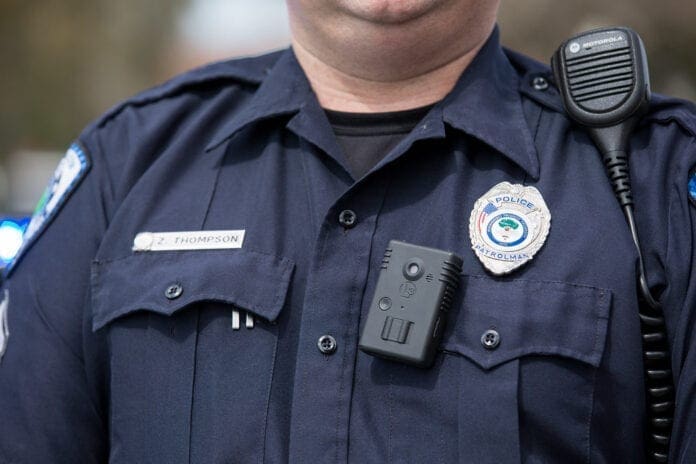 A police officer wearing a body camera.