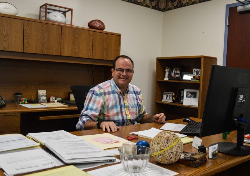 A man sitting at his desk.