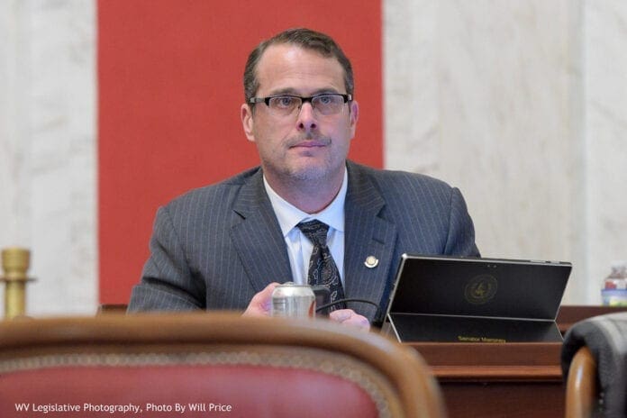 A man sitting and listening.