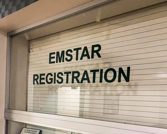 A photo of a window with writing on it.