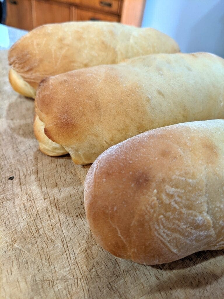 A row of baked pepperoni rolls.