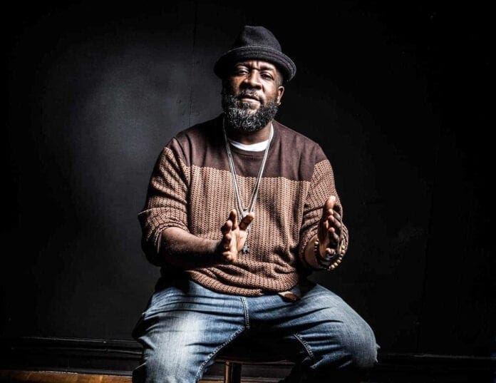 A photo of a black man talking.