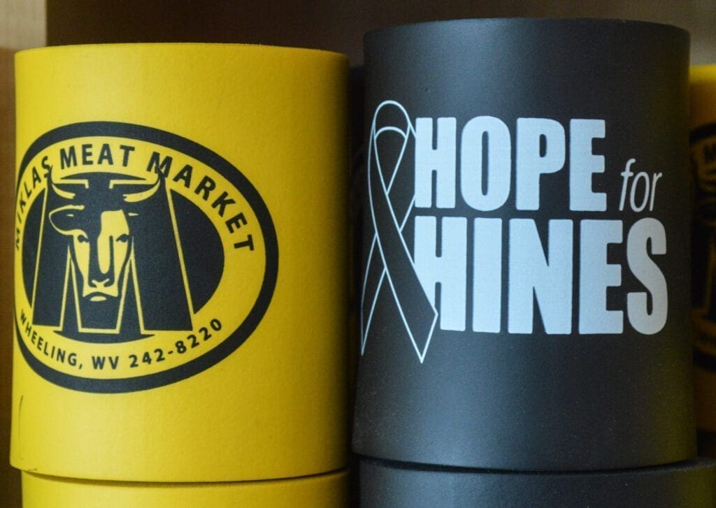 Black and gold beer koozies.