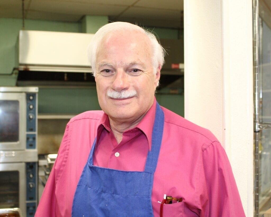 A man wearing an apron.