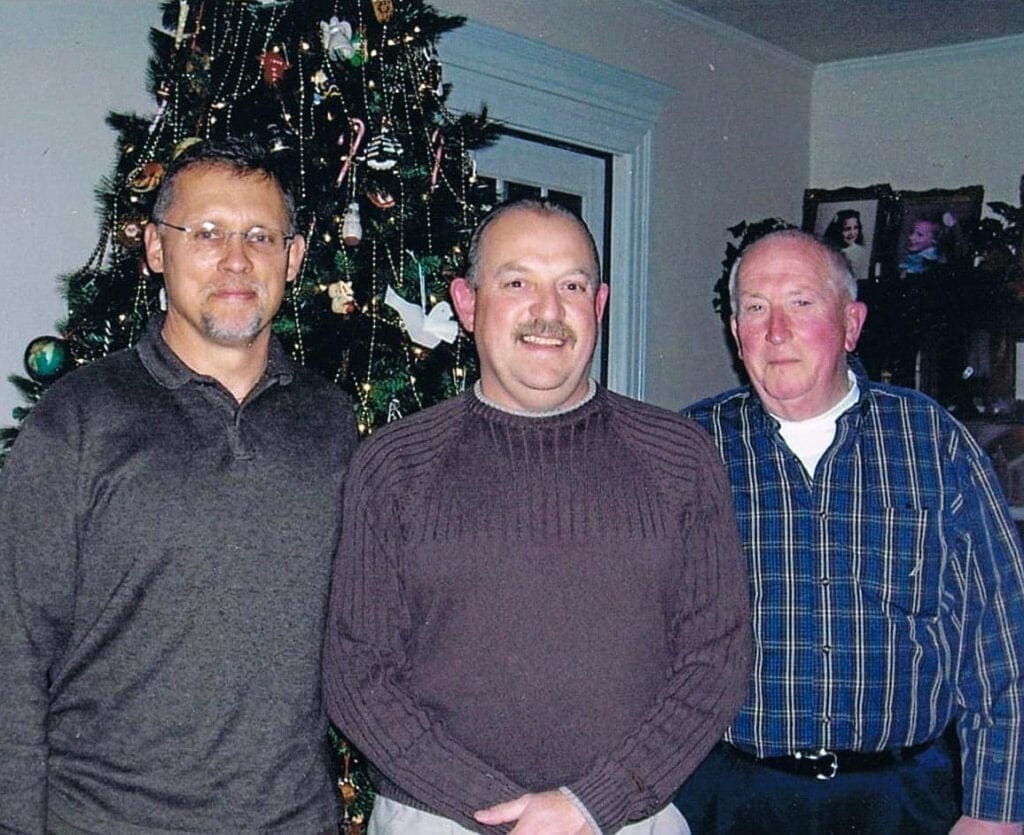 Three men posing for a photo.