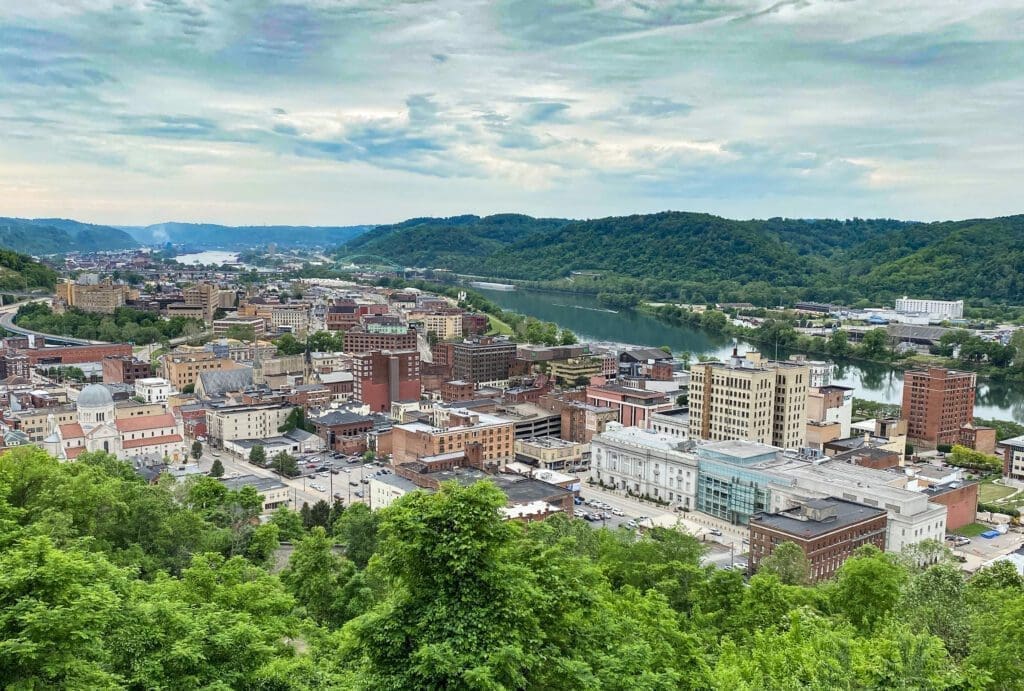 A large downtown area from the top of a hill.