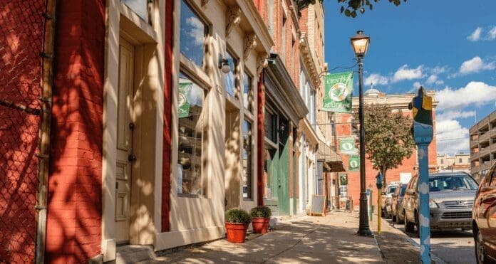 A photo of a number of small shops along a street.