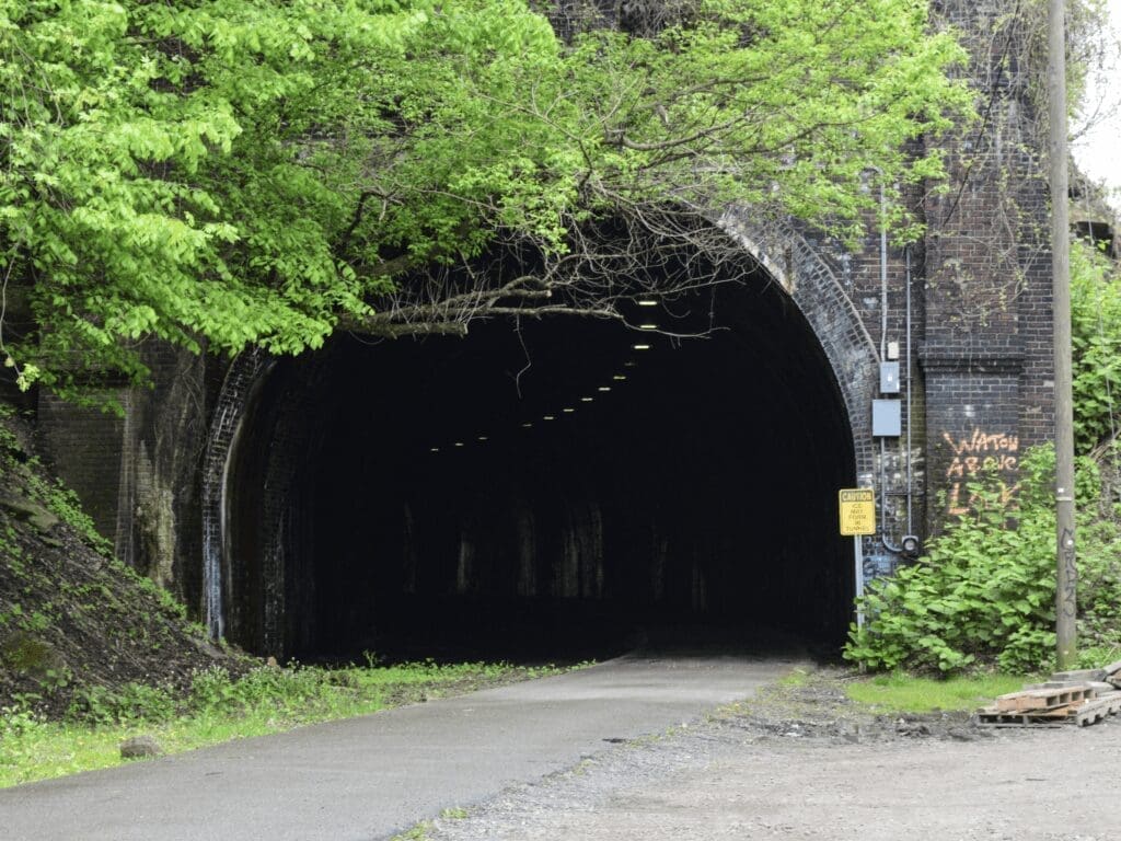 The opening of a train tunnel.