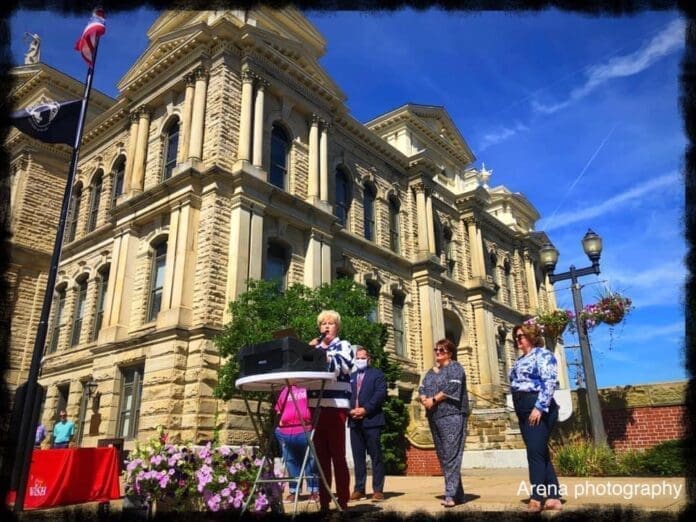 A person publicly speaking.