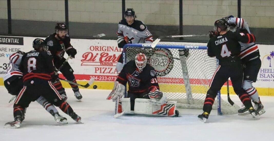 Two hockey teams on ice.