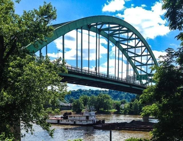 A barge under a bridge.