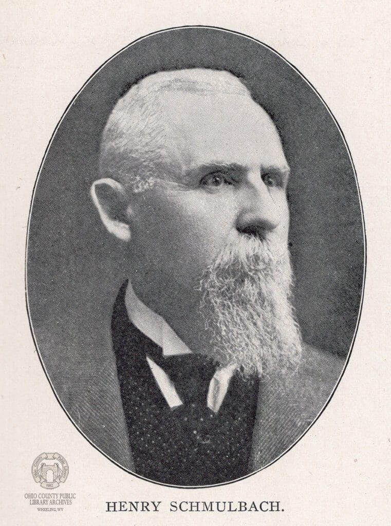 A bearded man posing for a portrait.