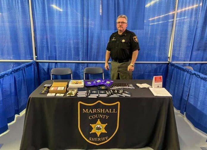 A man standing at a table.
