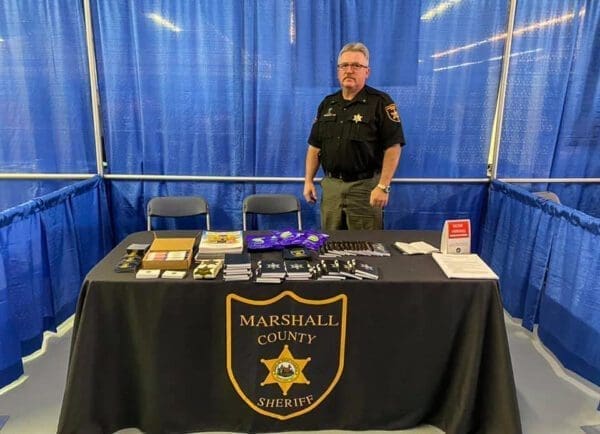 A man standing at a table.