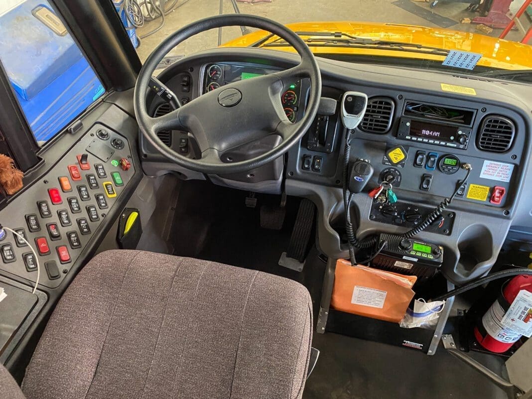 The driver's seat of a school bus.