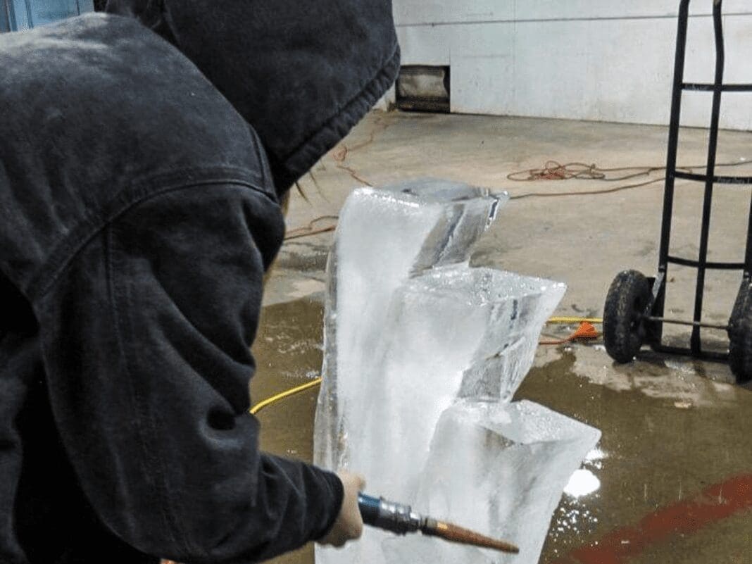 A student carving ice.