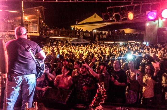 F143527F-C61B-47BC-A1DD-C38D8FDC0420 A man on a stage.