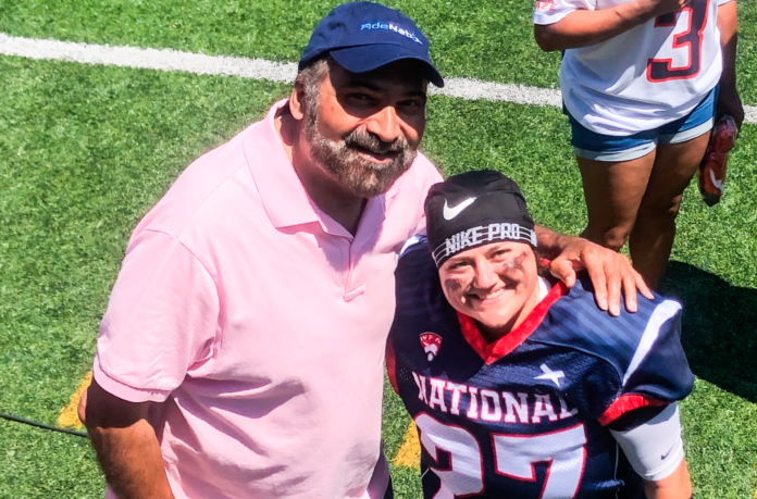 0F5A1C94-33DA-4405-BBAF-EDF527E7479C Franco Harris with a lady.