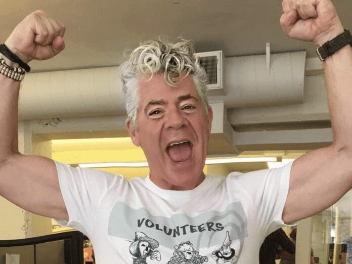 10F7DBEA-BA9E-4B1C-9194-B217C90CBF9F A man with his arms up.