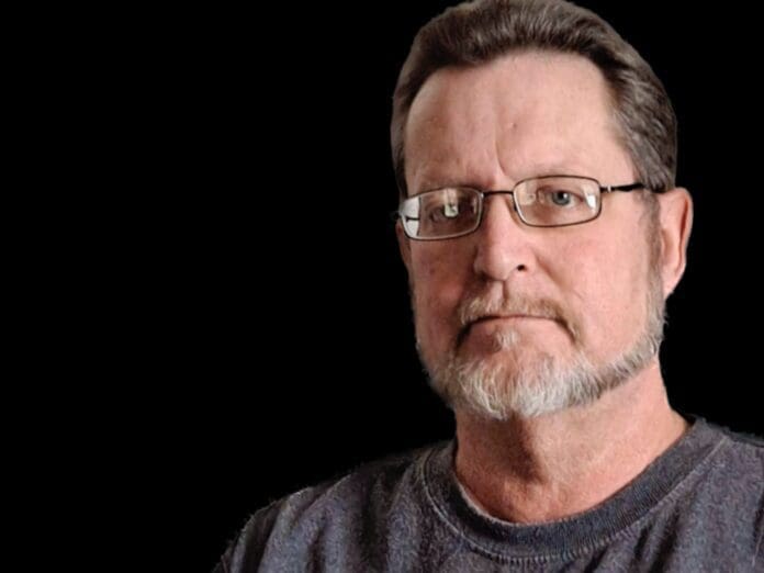 2F7F4EE4-3970-4F87-953A-F95BC24BFC2D A man posing for a pic.