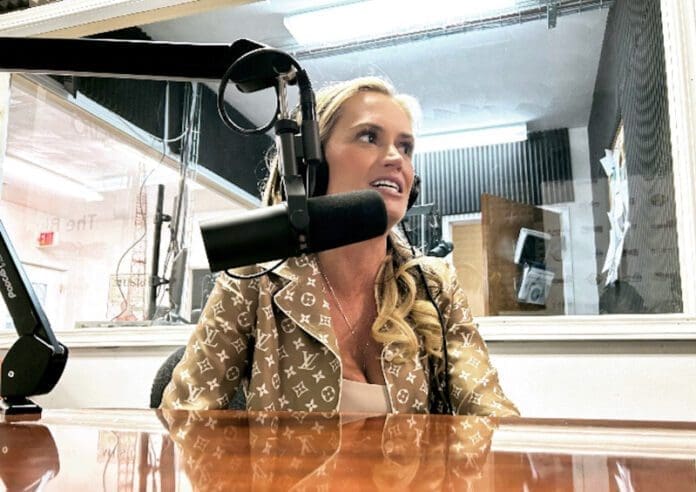 B62C4258-134E-43A4-990E-1A36E038B586 A woman in front of a microphone.