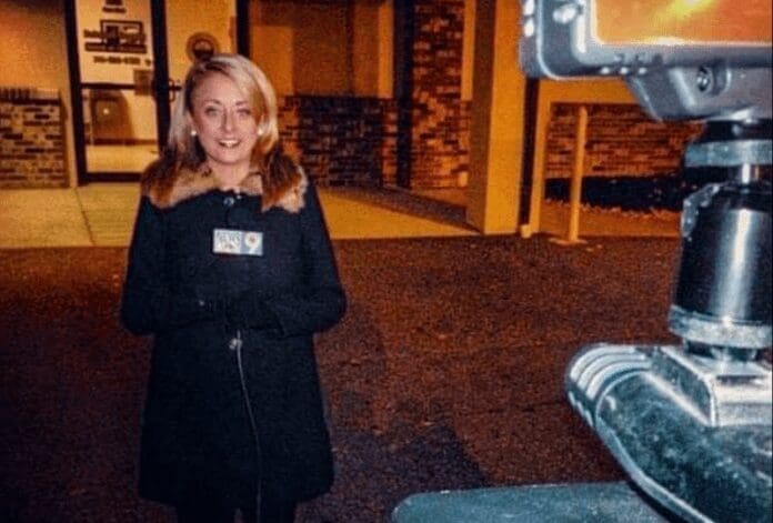 DC0CACB2-893A-4CC5-9BD1-C434DBCD0D87 A woman in front of a camera.