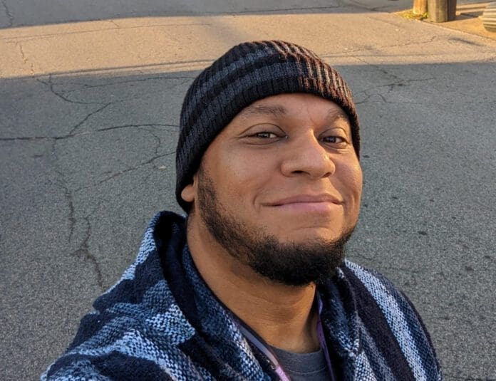 1CA5E173-934E-400D-B85D-AB348F5BC50A A man smiling.