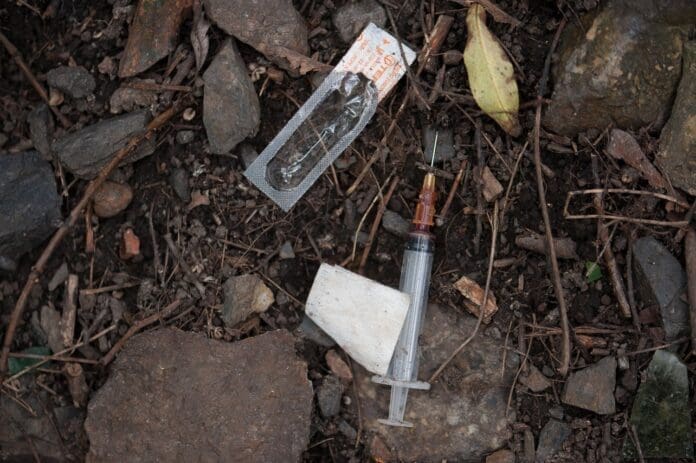 Heroin syringe A needle on the ground.