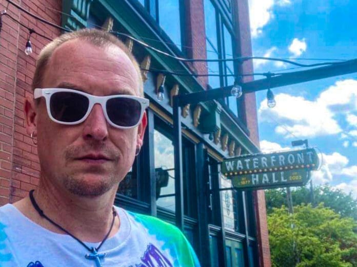 C7F67D0C-8902-4FB8-BF48-469777CF73B9 A man wearing sunglasses.