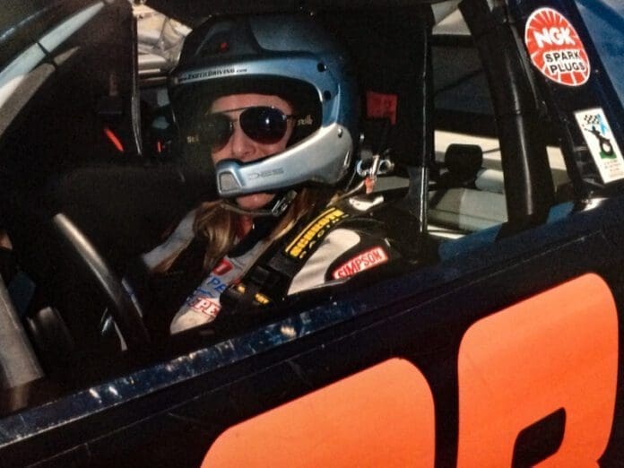 DE0619AB-8CA8-4724-A310-D697B30DF6DE A woman in a race car.