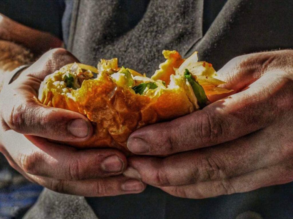 A burger in a man's hands.