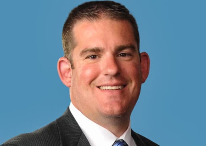 FB1CE6D0-C1E9-443A-957B-CC5715F62AA8 A man's headshot.