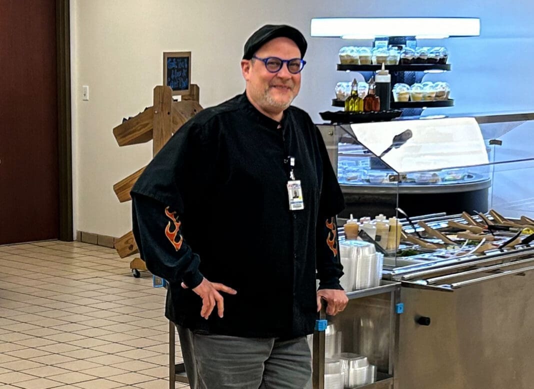 A man in a cafeteria.