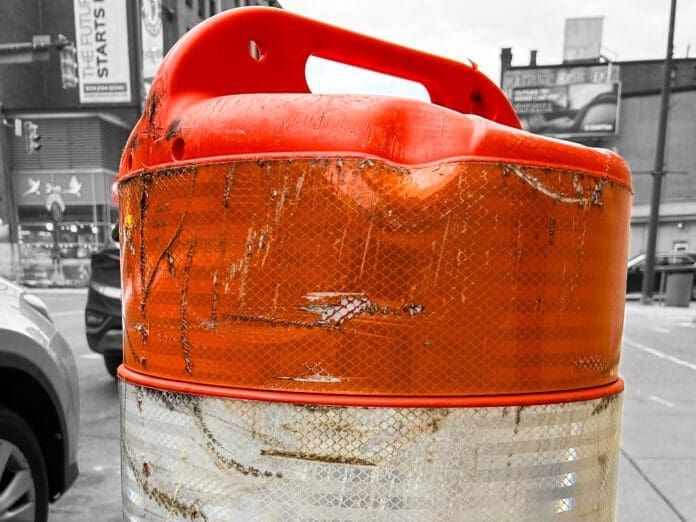 520D6178-7D26-4287-A220-995BE8B50532 An orange barrel.